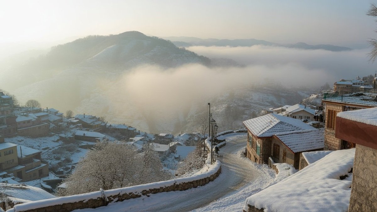 Snow-covered hills and roads in Murree during winter as cold weather conditions develop in January 2026.