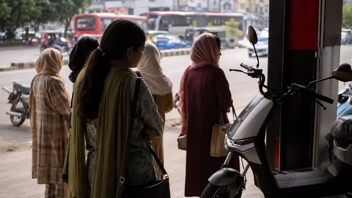 Explained: Why Pakistan's Women E-Bike Quota Faces a Test Woman applying for electric bike scheme registration in Pakistan