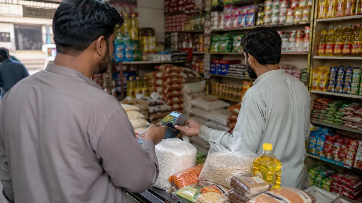 Registered Punjab worker using the Rashan Card at an approved grocery shop