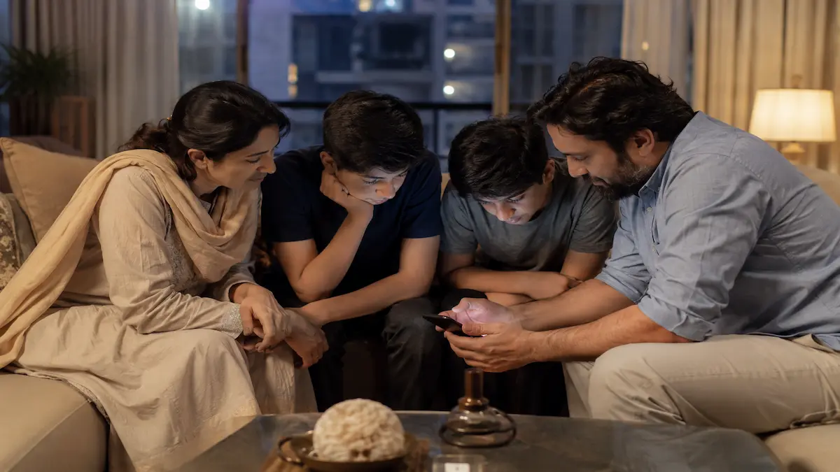 Child using smartphone illustrating Punjab social media age limit proposal