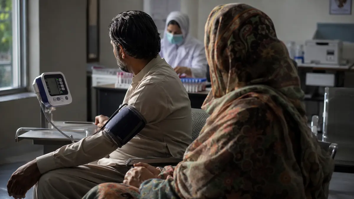 Doctor checking blood pressure for kidney health screening in Pakistan